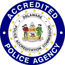 Accredited Police Agency seal featuring the Delaware state coat of arms in the center, surrounded by the words “Delaware Police Accreditation Commission.”
