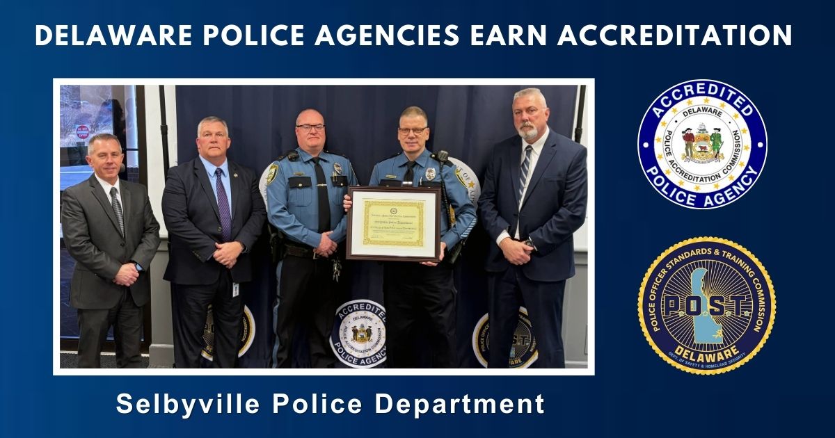 Five men, including two uniformed police officers, stand together while holding an accreditation certificate for the Selbyville Police Department beneath the heading “Delaware Police Agencies Earn Accreditation,” with Delaware Police Accreditation Commission and Delaware POST logos displayed on the right.